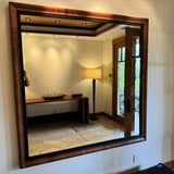 Oversized custom mirror with matching figured-wood and hammered-Metal Frame