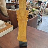 Gold-Toned Geometric Sculpture on Black Stand