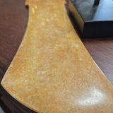 Gold-Toned Geometric Sculpture on Black Stand