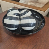 Four Black-and-Ivory Decorative Orbs with Black Bowl