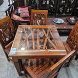 Elegant Carved Wooden Dining Set with Glass Top